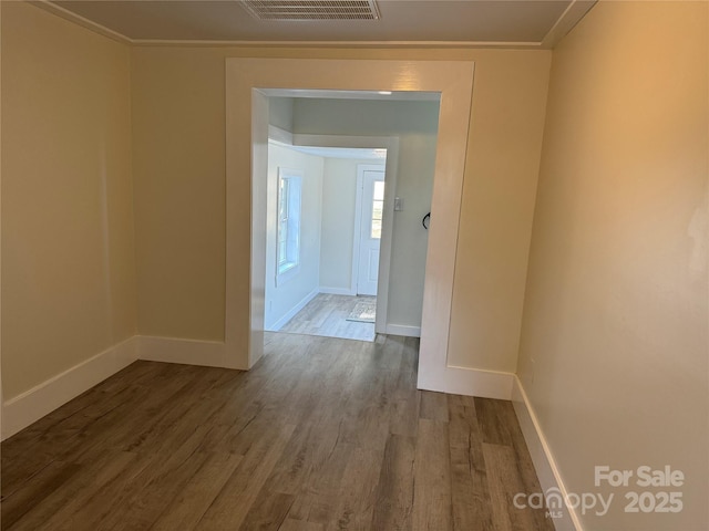 spare room with wood-type flooring