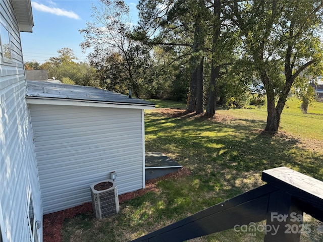 view of yard with central AC