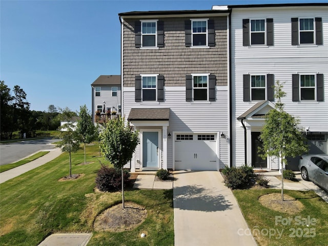 view of front of house with a garage and a front yard