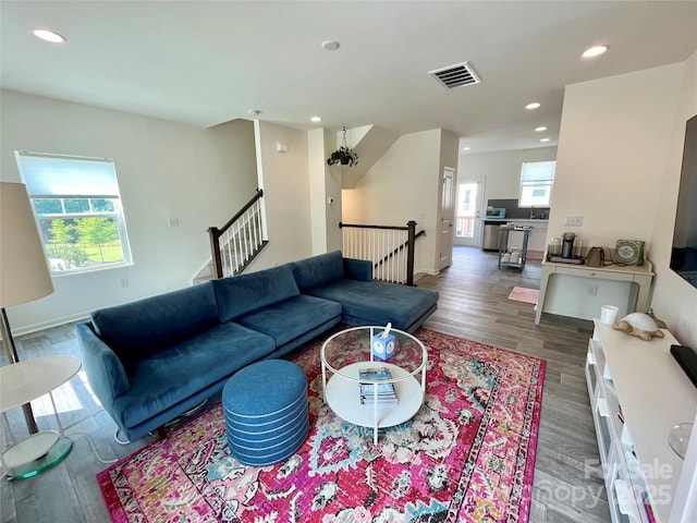 living room featuring dark wood-type flooring