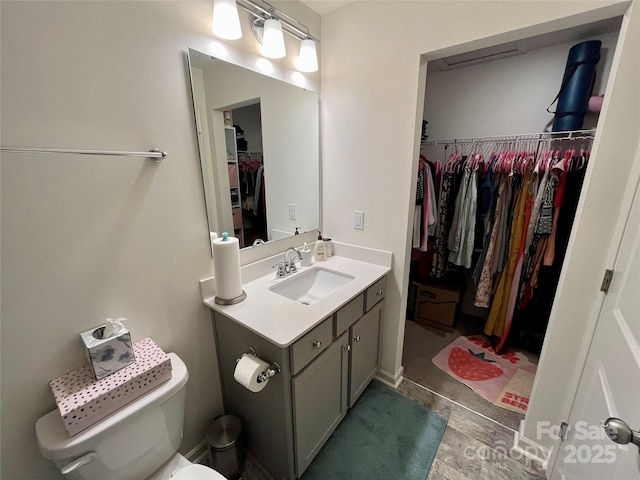 bathroom with vanity and toilet