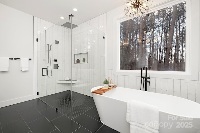 bathroom with separate shower and tub and tile patterned floors