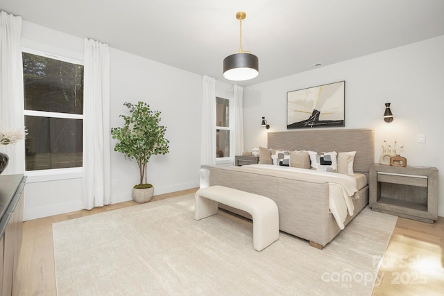 bedroom with light hardwood / wood-style floors