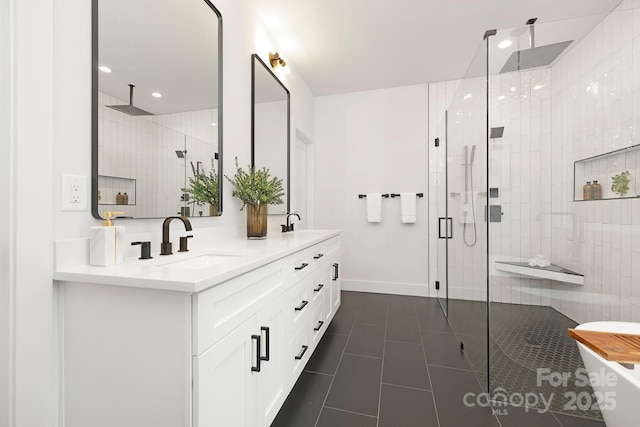 bathroom with vanity, a shower with door, and tile patterned floors