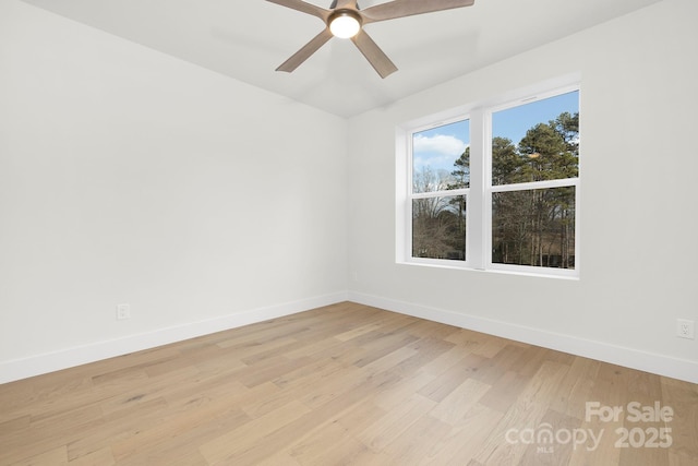 empty room with ceiling fan and light wood-type flooring