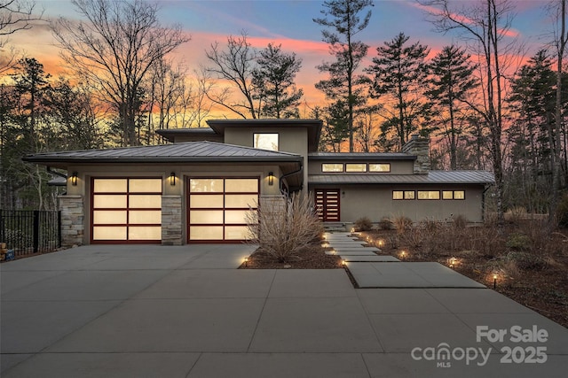 prairie-style home featuring a garage