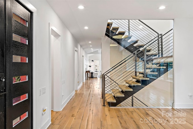 staircase featuring wood-type flooring