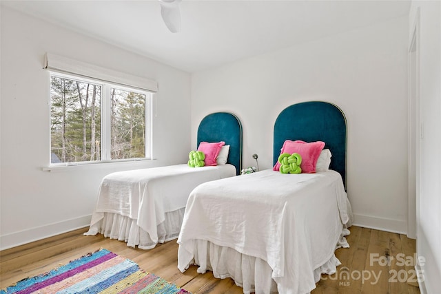 bedroom featuring hardwood / wood-style flooring and ceiling fan