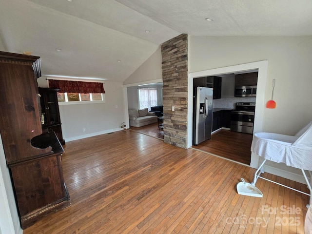 living room with lofted ceiling and wood-type flooring