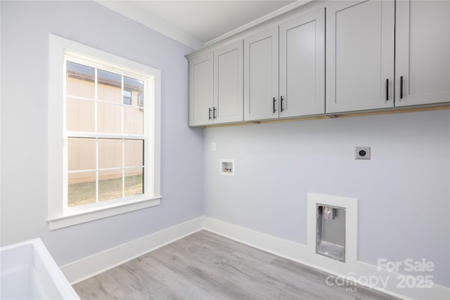 laundry area with cabinets, ornamental molding, hookup for a washing machine, hookup for an electric dryer, and light wood-type flooring