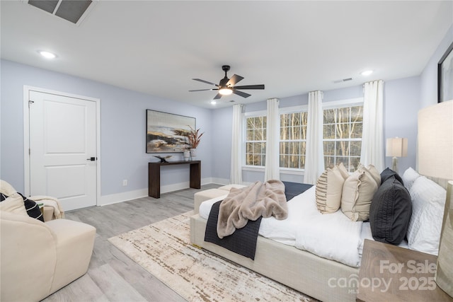 bedroom featuring light wood-type flooring and ceiling fan