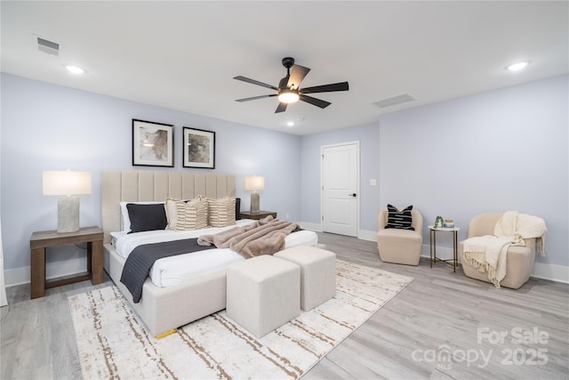 bedroom featuring light hardwood / wood-style flooring and ceiling fan