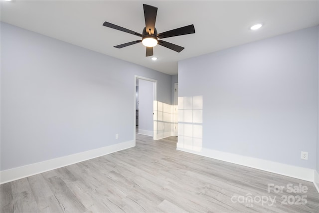 unfurnished room with ceiling fan and light wood-type flooring