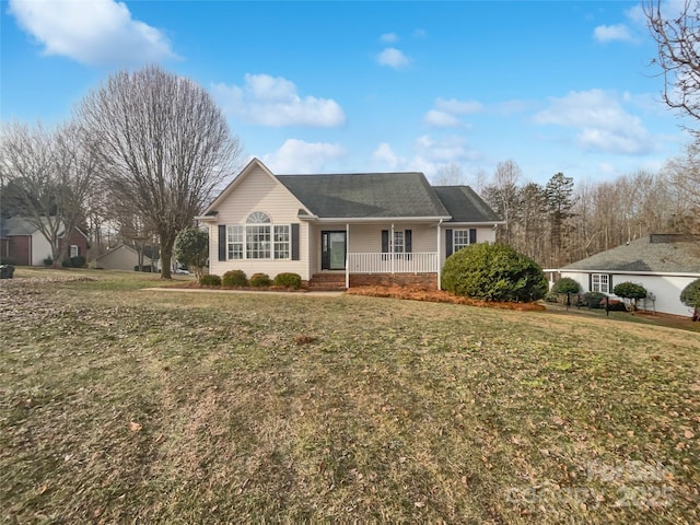 ranch-style house with a front yard and covered porch