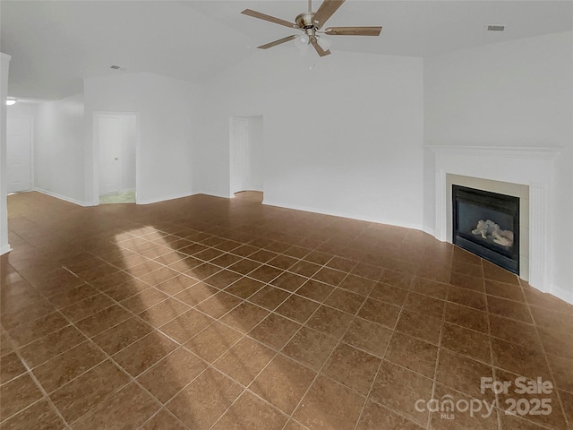 unfurnished living room featuring lofted ceiling and ceiling fan