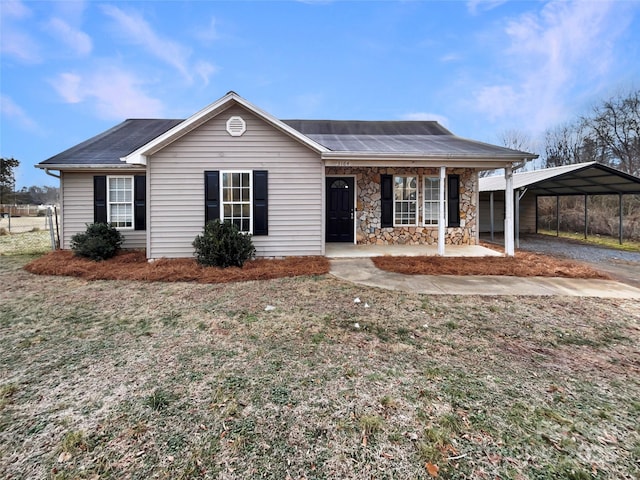 single story home with a carport and covered porch