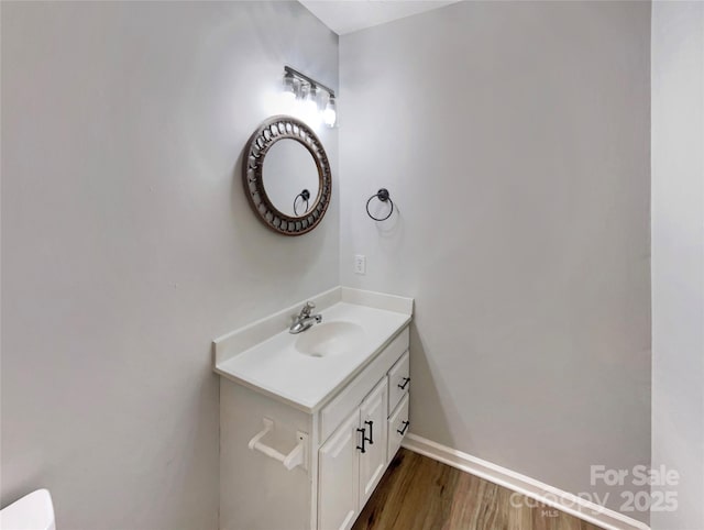 bathroom with vanity and hardwood / wood-style floors