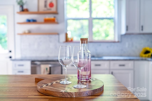 kitchen featuring white cabinetry and a healthy amount of sunlight