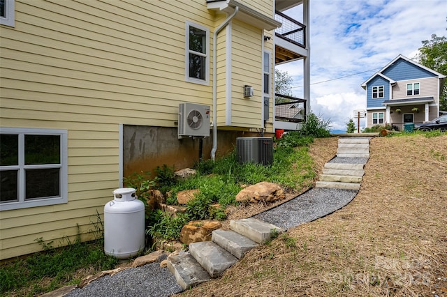 view of home's exterior featuring cooling unit and ac unit