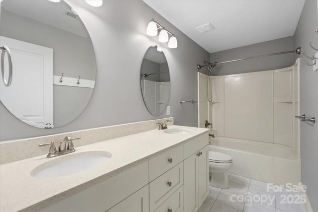 full bathroom with tile patterned floors, toilet, bathing tub / shower combination, and vanity