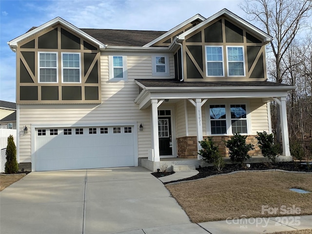 view of front of property featuring a garage and covered porch