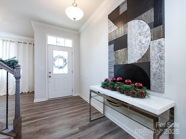 foyer entrance with hardwood / wood-style flooring and crown molding