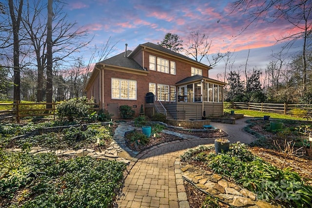 view of front of property featuring a sunroom