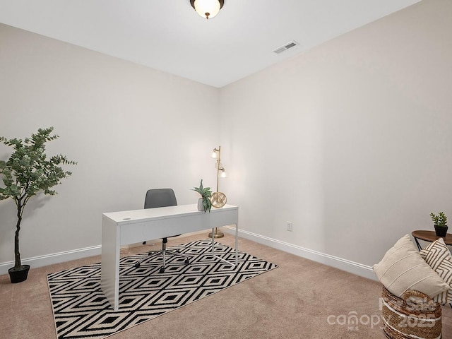 home office with light carpet, visible vents, and baseboards