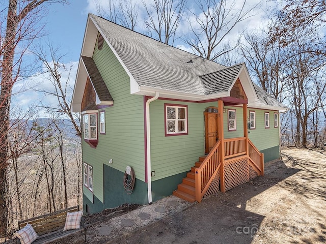 view of front of property with a shingled roof