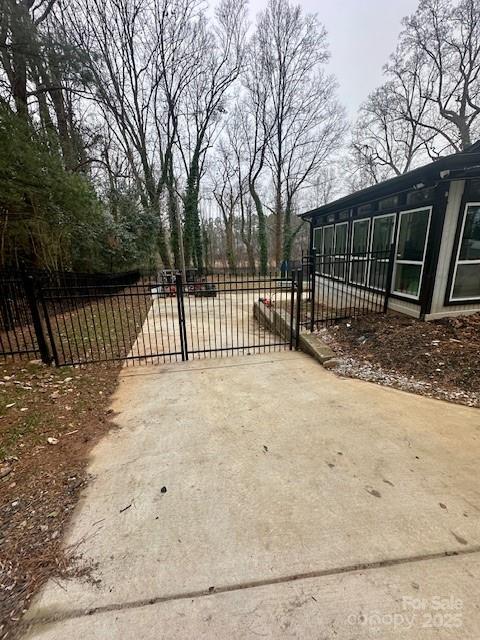 view of gate with fence