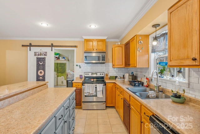 kitchen with tasteful backsplash, sink, light tile patterned floors, stainless steel appliances, and a barn door