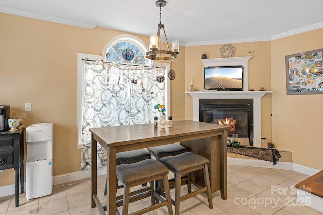 dining room with a notable chandelier, crown molding, and light tile patterned flooring