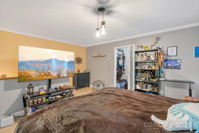 bedroom with crown molding, a spacious closet, light carpet, and a closet