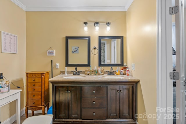 bathroom featuring ornamental molding and vanity