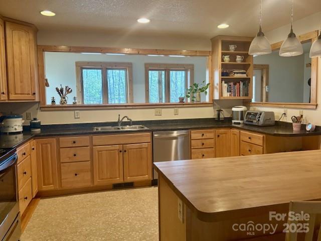 kitchen with sink, a textured ceiling, hanging light fixtures, stainless steel dishwasher, and stove