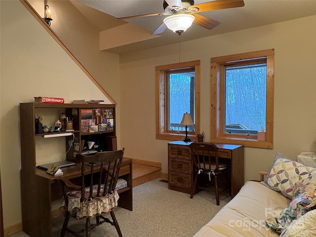 office area with light colored carpet and ceiling fan