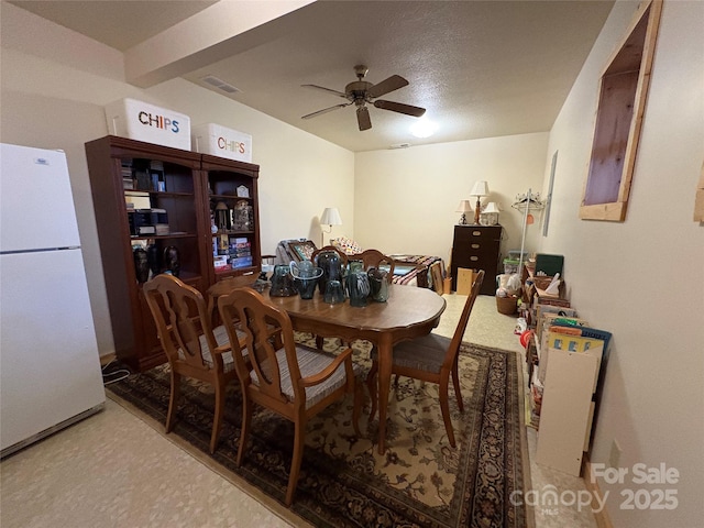 dining room featuring ceiling fan