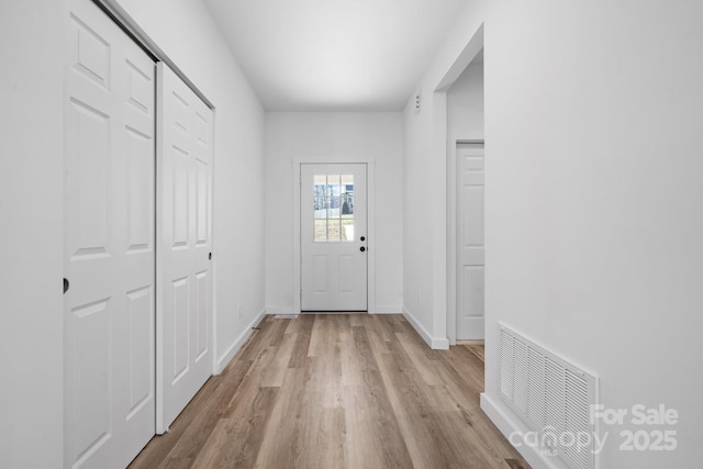 doorway with light hardwood / wood-style floors