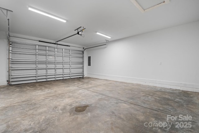 garage with a garage door opener and electric panel