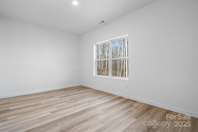 unfurnished room featuring light hardwood / wood-style flooring