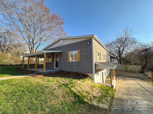 view of front of property with a porch and a front yard