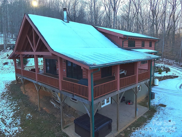 exterior space with a wooden deck and cooling unit