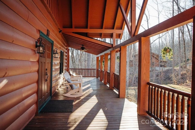 wooden deck featuring ceiling fan and a porch