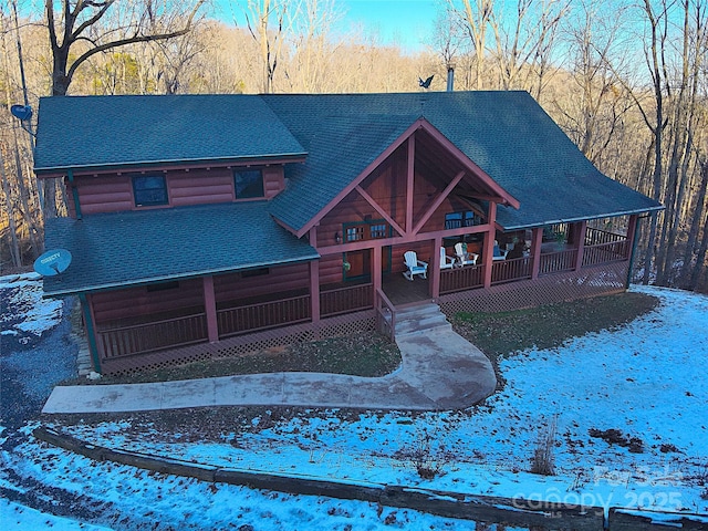 log cabin with a porch