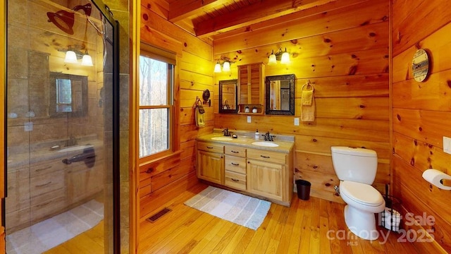 714 Heartwood Dr, Marion, NC 28752 - bathroom with hardwood / wood-style flooring, a shower stall, toilet, beam ceiling, and vanity