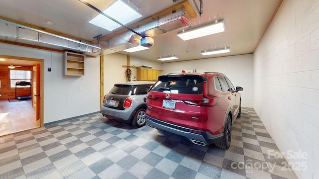 714 Heartwood Dr, Marion, NC 28752 - garage with a garage door opener and concrete block wall
