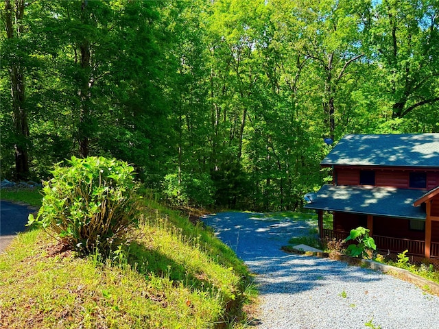 714 Heartwood Dr, Marion, NC 28752 - view of dirt / gravel road featuring a forest view