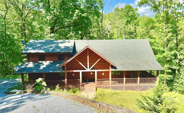 714 Heartwood Dr, Marion, NC 28752 - view of front of property featuring a porch, roof with shingles, and a wooded view