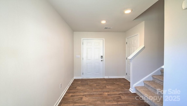 foyer entrance with dark hardwood / wood-style flooring