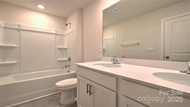 full bathroom featuring tile patterned flooring, vanity, tub / shower combination, and toilet